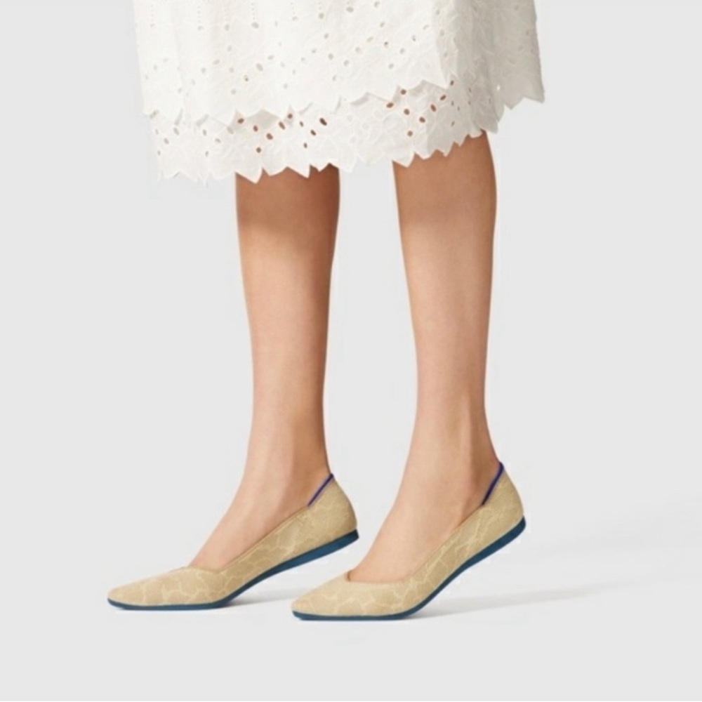 Rothy’s retired Sahara gold point giraffe print flats